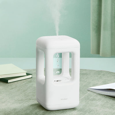 White anti-gravity water drop humidifier with visible mist output and 'Winben' brand name, on a white stand. - Image 3