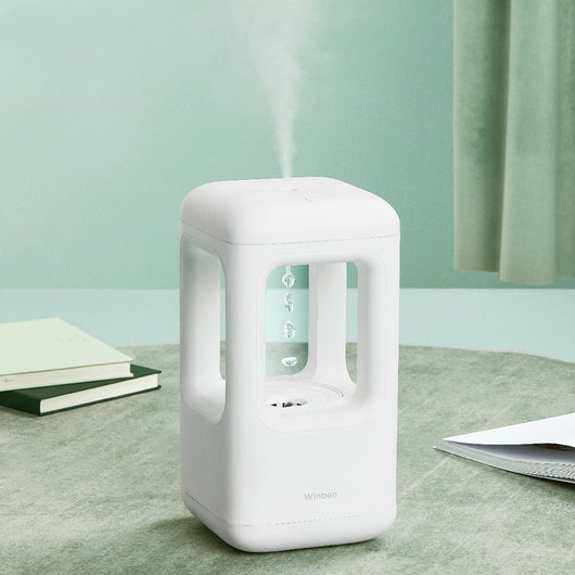 White anti-gravity water drop humidifier with visible mist output and 'Winben' brand name, on a white stand. - Image 3