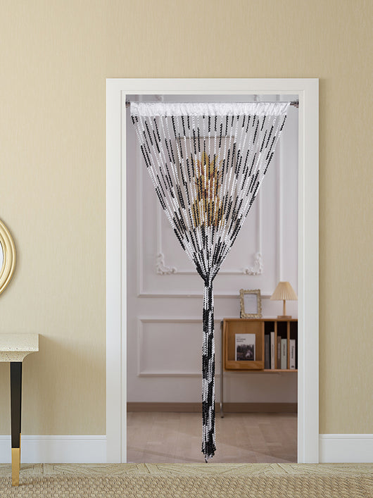 Brown and beige striped string curtain with twisted tassel texture, held by a hand, for living room partition. - Image 3