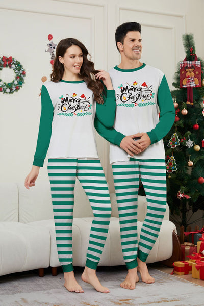Family of four wearing matching green and white striped Christmas pajamas with "Merry Christmas" graphic. - Image 17