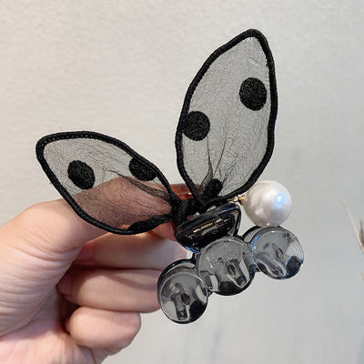 Black sheer polka dot rabbit ears hair claw clip with a faux pearl and gold-toned metal accents. - Image 19