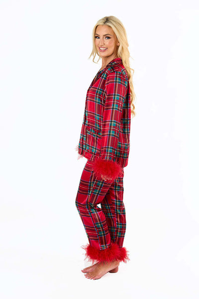 Young girl in a leopard print pajama set with black feather trim on the cuffs and ankles, wearing a pink glitter headband. - Image 35