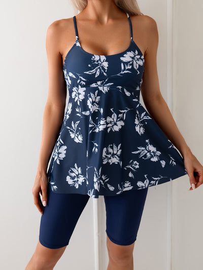 Women's navy blue two-piece swimsuit with white floral tankini top and matching solid swim shorts. - Image 15