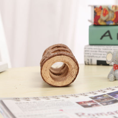 Natural solid wood pipe with bark texture and multiple holes, serving as a chew toy or hideout for small pets. - Image 4