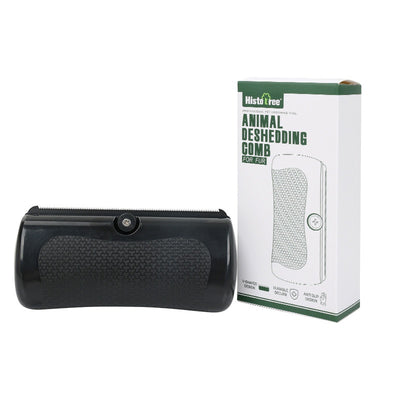 Black HistoTree animal deshedding comb with a textured grip, shown next to its white and green retail box. - Image 6
