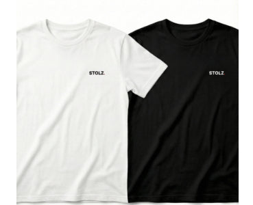 Two loose-fitting short-sleeve t-shirts, one white and one black, both with 'STOLZ' text on the chest. - Image 6
