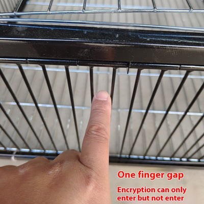 Black wire pigeon cage with a flat top and bottom, designed for one-way entry, shown on a gray surface. - Image 7