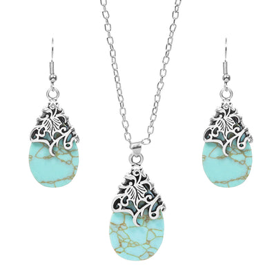 Vintage-style silver-tone necklace and dangle earrings set with oval frames and marbled blue and yellow stones. - Image 5