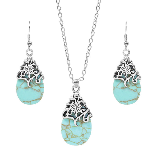 Vintage-style silver-tone necklace and dangle earrings set with oval frames and marbled blue and yellow stones. - Image 5