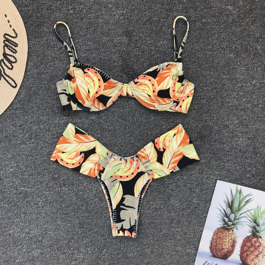 Tropical leaf print bikini with underwire gathered top and high-waisted bottoms in orange, yellow, and black. - Image 12