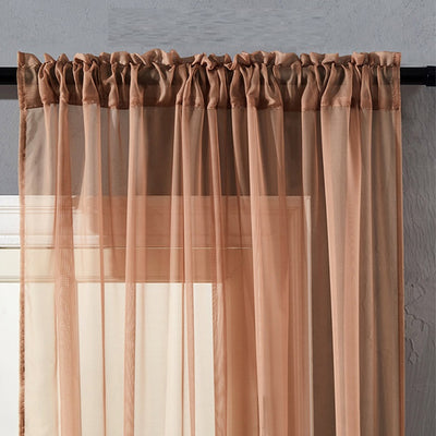 Sheer pink rod pocket curtain hanging on a black curtain rod, offering light transmission for a modern room. - Image 9