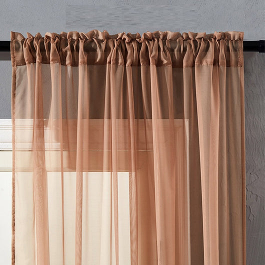 Sheer pink rod pocket curtain hanging on a black curtain rod, offering light transmission for a modern room. - Image 9