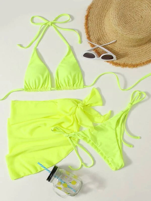 Neon yellow three-piece bikini set with triangle cup lace-up top, tie-side bottom, and matching sarong, displayed with a straw hat and sunglasses. - Image 14