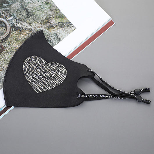 Black ear-mounted mask with a sparkling rhinestone bow pattern, featuring adjustable ear loops. - Image 3
