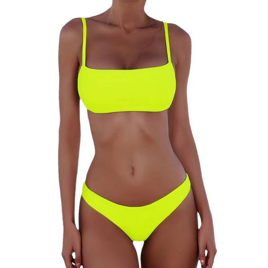 Women's casual orange textured bikini set with scoop neck top and high-cut bottoms against a stone wall. - Image 6