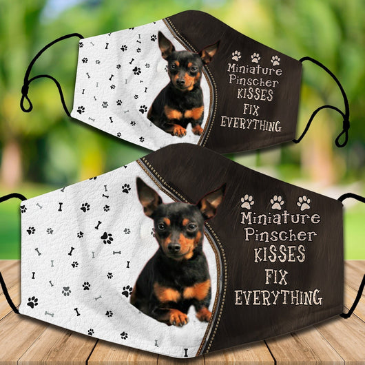 Two cotton face masks with a Bichon Frise dog, paw prints, and bones on a white and brown background. Text reads "Bichon Frise KISSES FIX EVERYTHING." - Image 54