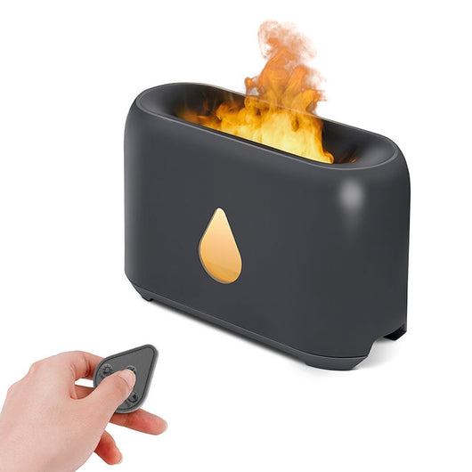 White aroma diffuser with a 3D flame effect and a gold water droplet icon, shown with a remote control. - Image 2