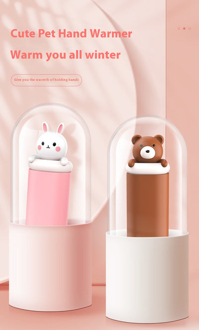 Dark green paw-shaped hand warmer and power bank with a cute bear design, held in a hand with white faux fur gloves. - Image 23