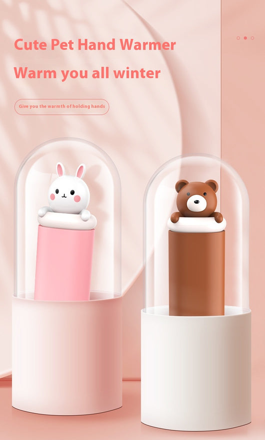 Dark green paw-shaped hand warmer and power bank with a cute bear design, held in a hand with white faux fur gloves. - Image 23