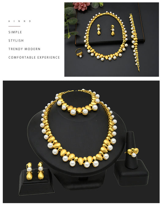 Women's four-piece jewelry set with matte gold teardrop links and white pearls, including a necklace, earrings, ring, and bracelet. - Image 12