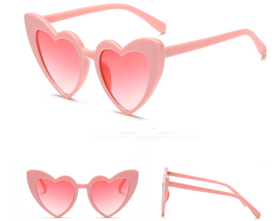 White heart-shaped sunglasses with dark gray lenses, shown from front, top, and side views on a white background. - Image 7