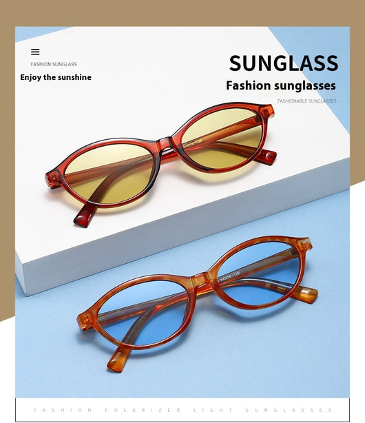 Retro fashion small frame sunglasses with translucent brown frames and yellow oval lenses, viewed from an angle. - Image 24