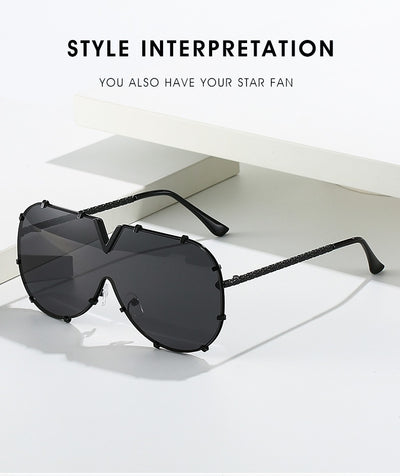 Oversized V-shaped sunglasses with a gold metal frame, white accents, clear lenses, and decorative rivets. - Image 20
