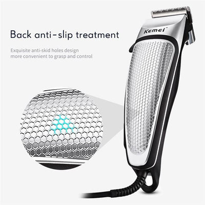 Kemei electric hair clipper kit with silver and black trimmer, four guide combs, scissors, comb, and cleaning brush. - Image 3