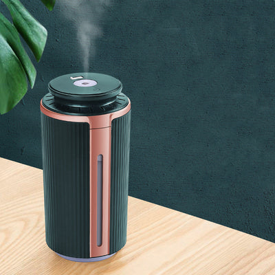 Green and rose gold mini silent humidifier with ribbed texture, USB night light, and water level indicator. - Image 3