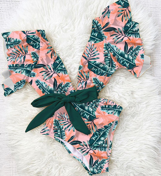 Coral one-piece swimsuit with deep V-neck, ruffled sleeves, and tie-front waist, featuring pink and teal floral print. - Image 20