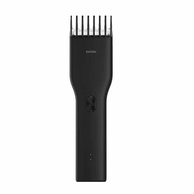 Black cordless hair shaver with a comb attachment and two white indicator lights, with a blurred white shaver in the background. - Image 4