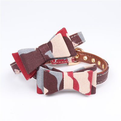 Two pet collars with blue, white, and tan camouflage bowknots and brown lining on a white background. - Image 3