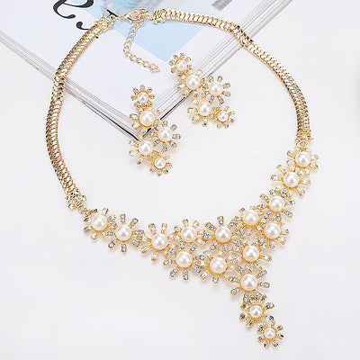 Gold-toned heart-shaped necklace and dangle earrings set with clear rhinestones and faux pearls. - Image 8