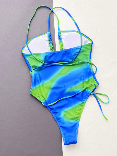 Women's blue and green tie-dye one-piece swimsuit with a tube top, hollow cut-outs, and criss-cross straps. - Image 17