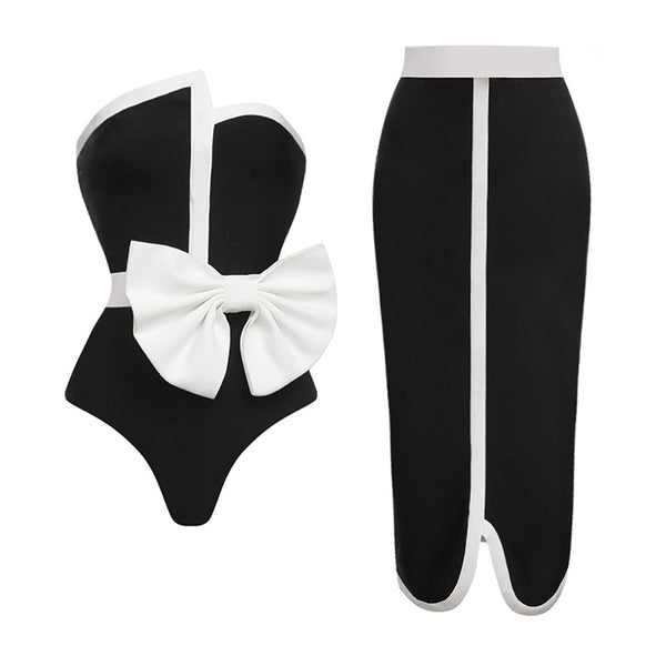 Black and white color-block one-piece swimsuit with an irregular tube top and a large white bow, paired with a matching pencil skirt. - Image 4
