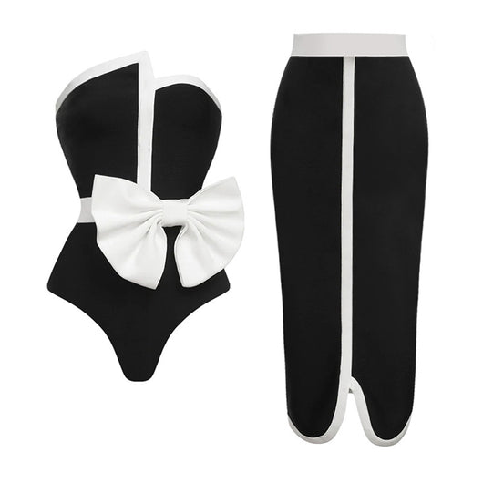 Black and white color-block one-piece swimsuit with an irregular tube top and a large white bow, paired with a matching pencil skirt. - Image 4