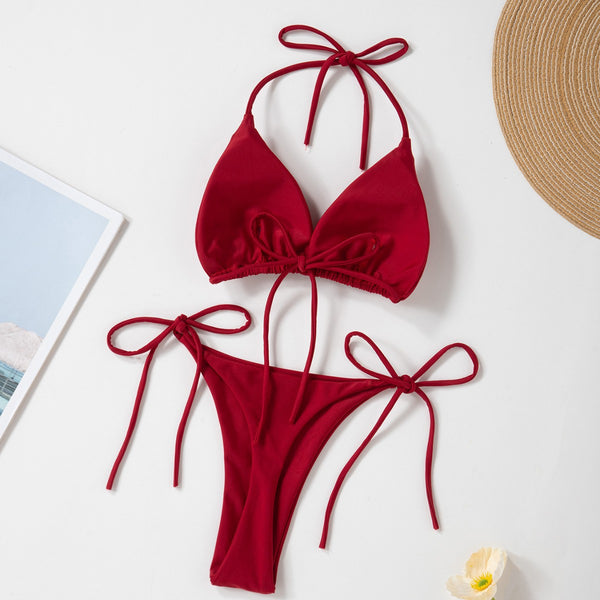 Red solid color two-piece bikini swimsuit with a halter tie-top and adjustable tie-side thong bottom.