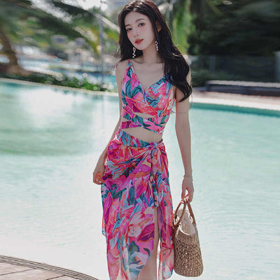 Women's three-piece swimwear set with a cream floral print, ruffled crop top, high-waisted shorts, and matching sarong. - Image 3