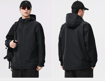 Man wearing a black windproof and waterproof outdoor jacket with a hood, sports sunglasses, and a bucket hat, holding a trekking pole. - Image 9