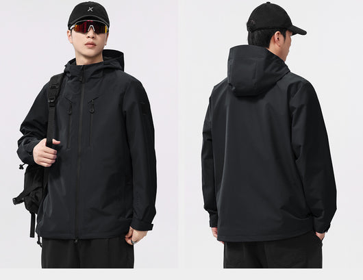Man wearing a black windproof and waterproof outdoor jacket with a hood, sports sunglasses, and a bucket hat, holding a trekking pole. - Image 9