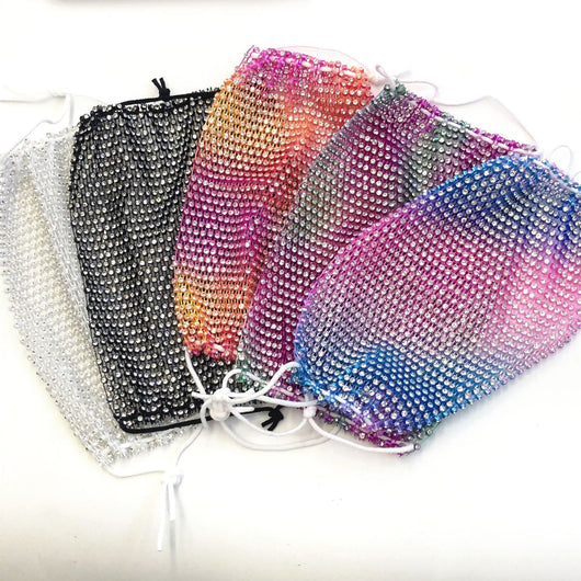 Close-up of a blue mesh fabric adorned with numerous small, clear rhinestones, creating a sparkling texture. - Image 42