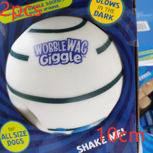 Wobble Wag Giggle dog sound ball, white with green stripes, in blue packaging highlighting glow-in-the-dark feature. - Image 7