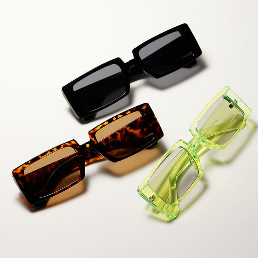 Cool black super retro sunglasses with rectangular frames and dark lenses, displayed on a white background.