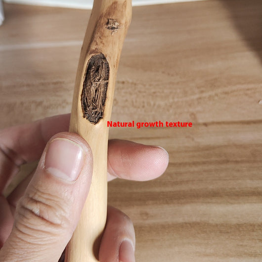 Natural wooden bird perch with an irregular branch-like shape and metal screw attachment, held by a hand. - Image 7