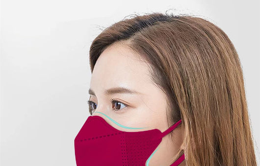 Peach disposable 3-layer face mask with perforated details worn by a person, offering comfortable daily protection. - Image 15