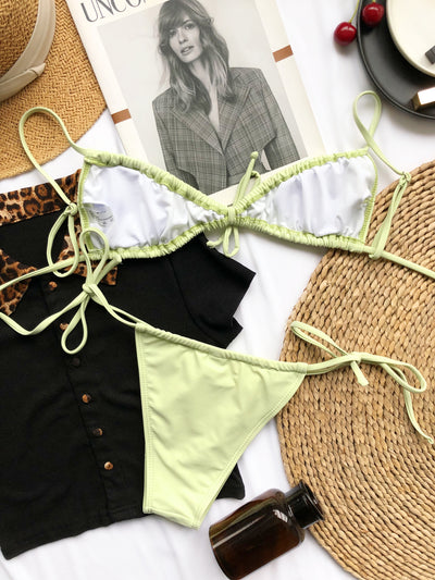 Light blue pleated bikini with triangle top and thong bottom, featuring adjustable tie closures on both pieces. - Image 15