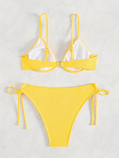 Black ribbed two-piece bikini with an underwire top and tie-side bottoms on a white marble surface. - Image 29