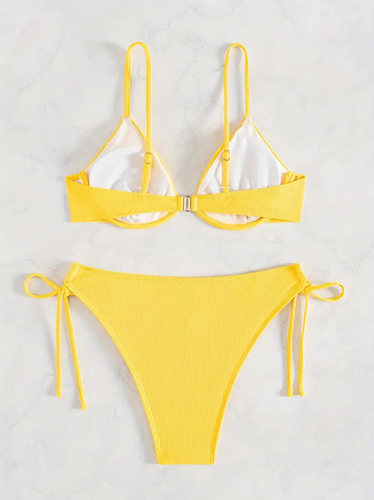 Black ribbed two-piece bikini with an underwire top and tie-side bottoms on a white marble surface. - Image 29