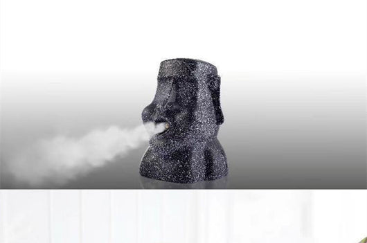 Retro gold and black stone portrait humidifier ornament emitting mist, mounted on a textured wall. - Image 7