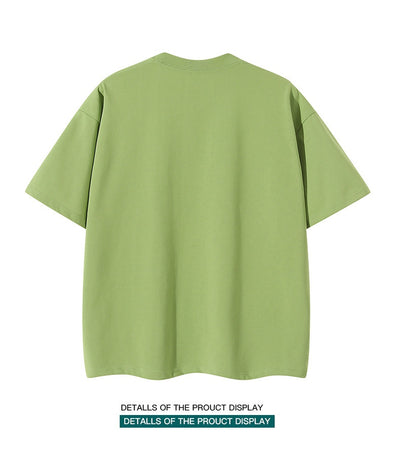 Moss green short-sleeve cotton t-shirt with a crew neck and a relaxed, oversized fit. - Image 18